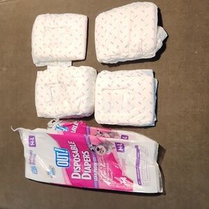 (4) OUT disposable unused diapers in original bag. M/L 18-25" waist / 15-40lbs